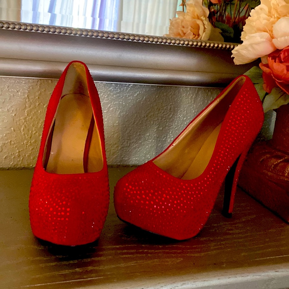 Shiny red high heels with red diamonds